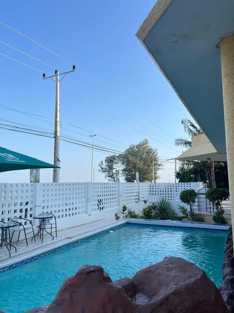 Pastello outdoor pool with seating area